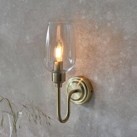Bastrop Clear Glass Wall Light In Antique Brass