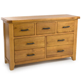 Hewitt Wide Wooden Chest Of 7 Drawers In Rustic Oak