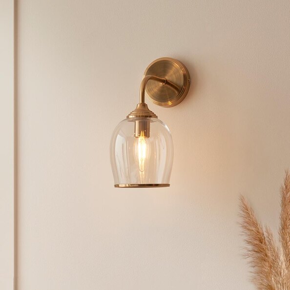 Aiken Clear Glass Wall Light In Brushed Aged Brass