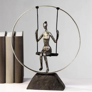 Swing Sculpture In Poly Metal Silver With Black Base - UK