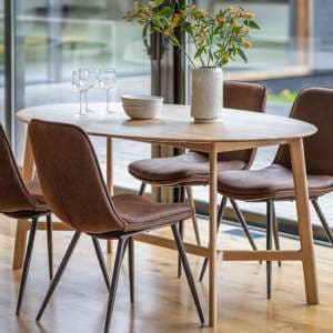 Madrina Oval Wooden Dining Table In Oak - UK