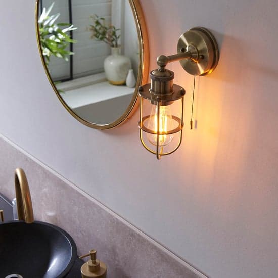 Adrian Industrial Caged Wall Light In Antique Brass_4