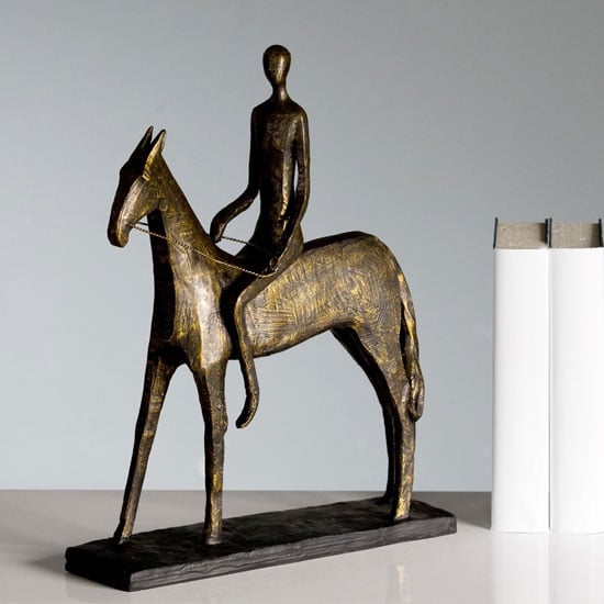 Read more about Rider sculpture in bronze with black metal base