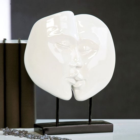 Photo of Faces sculpture in shiny white with black base