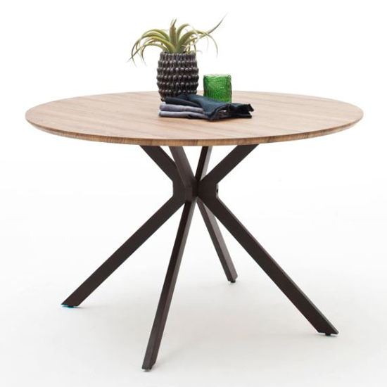 Photo of Artois wooden dining table round in wild oak and anthracite legs