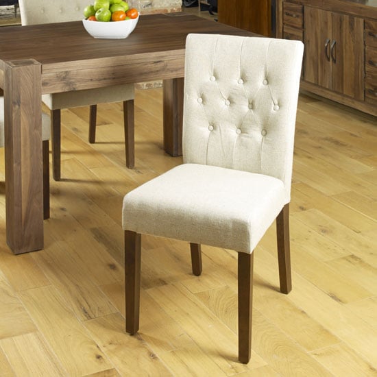 Read more about Novian dining chair in biscuit with walnut legs in a pair