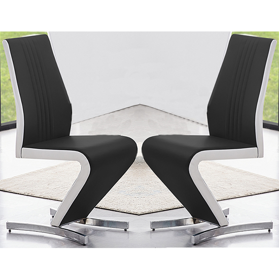 Photo of Gia black and white faux leather dining chairs in pair