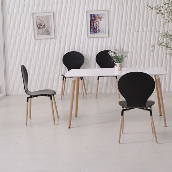 Photo of Napoli dining table in white top and 6 black dining chairs