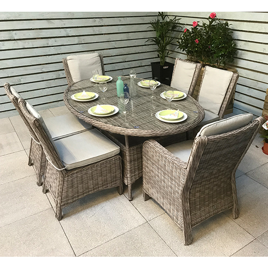 Photo of Abobo oval glass dining table with 6 armchairs in fine grey