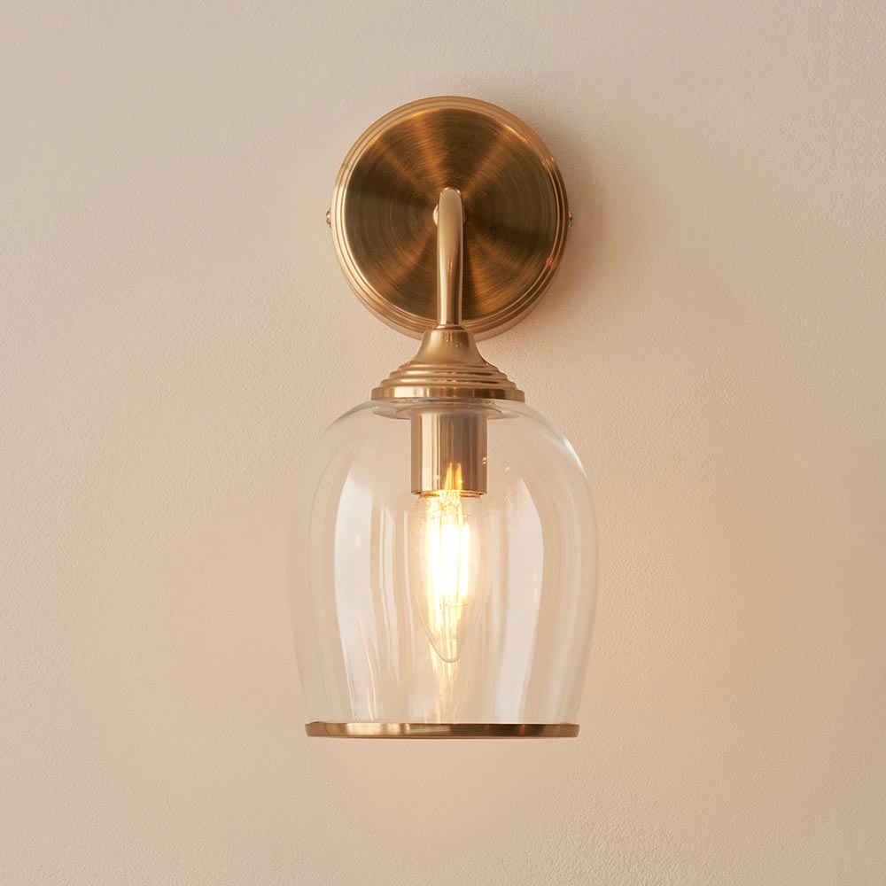 Aiken Clear Glass Wall Light In Brushed Aged Brass