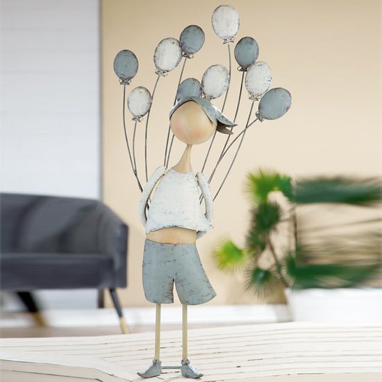 Product photograph of Akron Metal Boy With Heart Holding Back Sculpture In Grey White from Furniture in Fashion