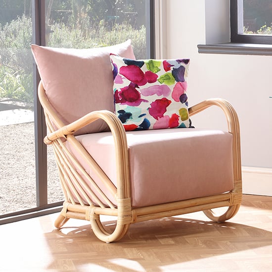 Photo of Akure rattan armchair with velvet blush seat cushion