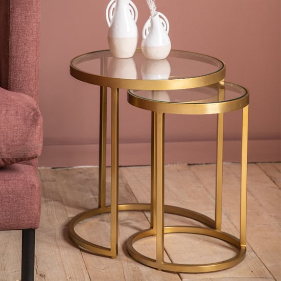 Product photograph of Alcoa Clear Glass Top Nest Of 2 Tables With Gold Metal Frame from Furniture in Fashion