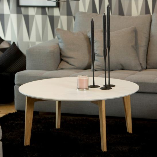 Read more about Allen wooden round coffee table in white with oak legs