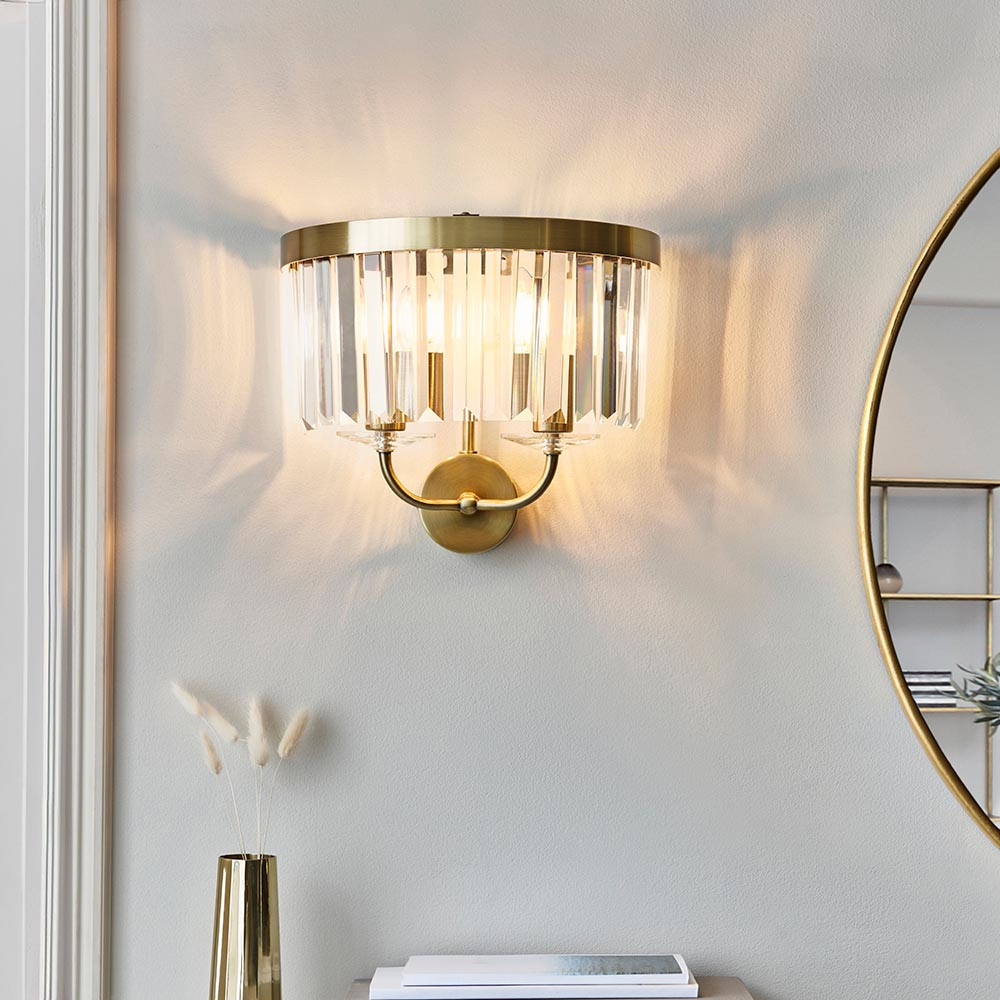 Read more about Allston clear glass wall light in antique brass