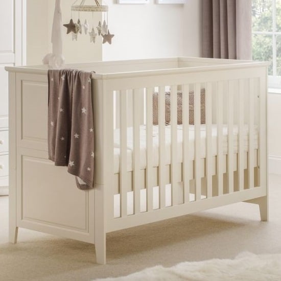 Photo of Caelia wooden cotbed in stone white lacquer finish