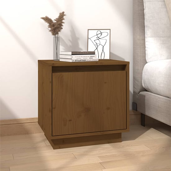 Read more about Aoife pine wood bedside cabinet with 1 door in honey brown