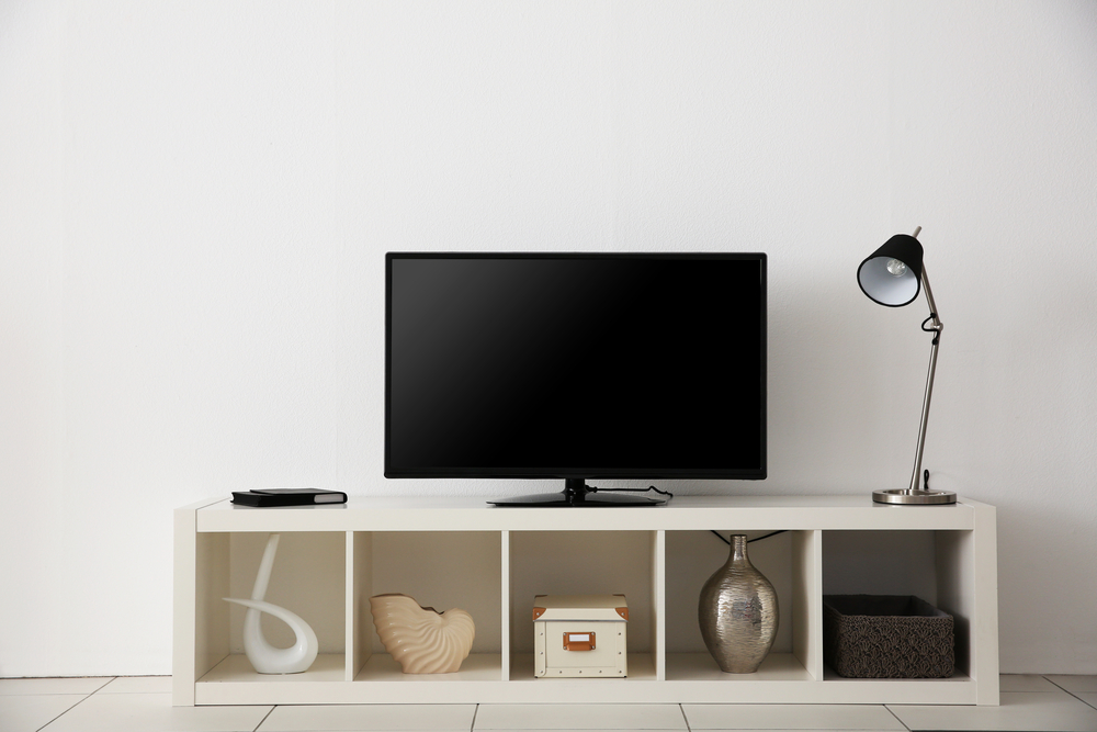 Buy a TV stand with chrome accent to add a contemporary touch to your house