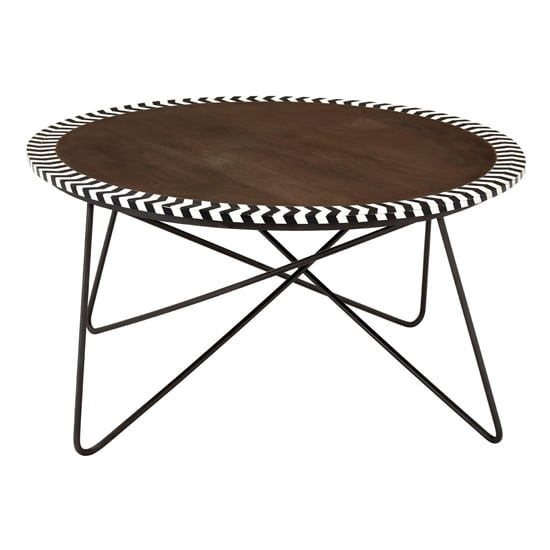 Photo of Artok round wooden coffee table with black legs in natural