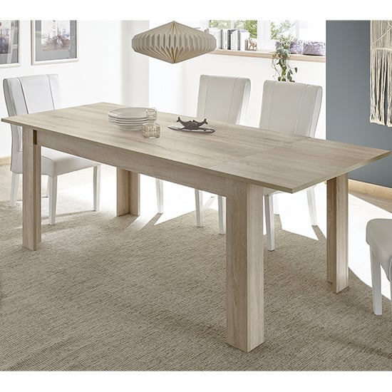 Photo of Aleta extending wooden dining table in sonoma oak