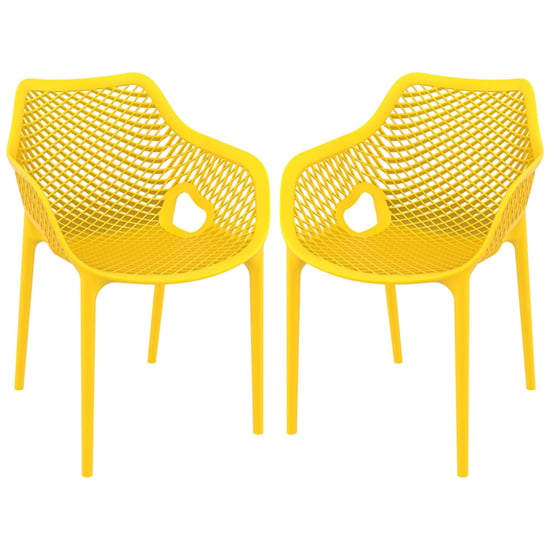 Photo of Aultos outdoor yellow stacking armchairs in pair
