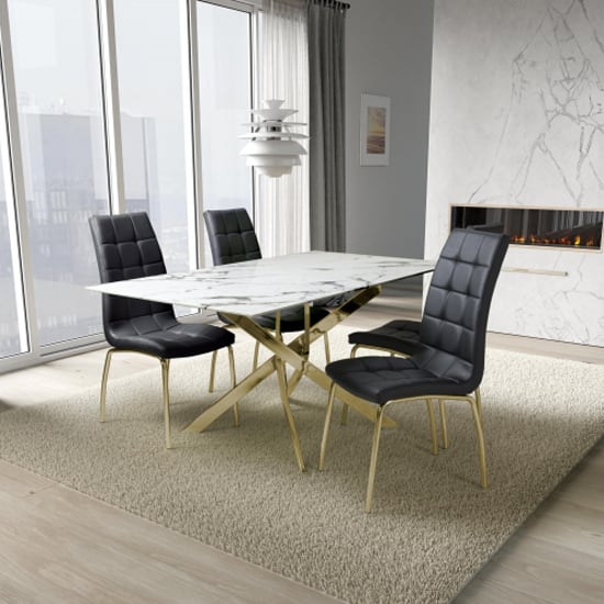 Read more about Avon dining table with gold legs and 4 justin black chairs