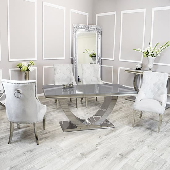 Photo of Avon grey glass dining table with 6 dessel light grey chairs