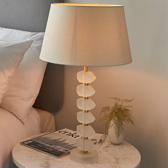 Photo of Awka ivory linen shade table lamp with frosted glass base