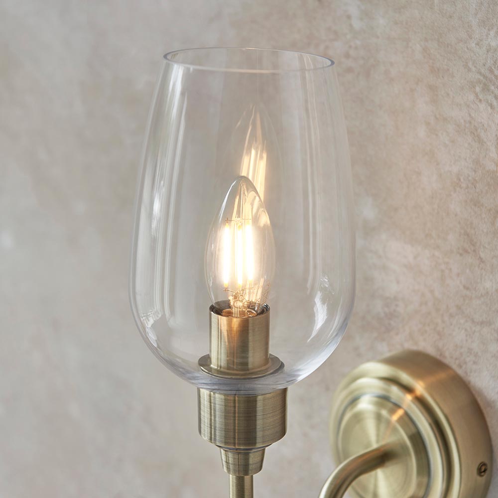 Bastrop Clear Glass Wall Light In Antique Brass