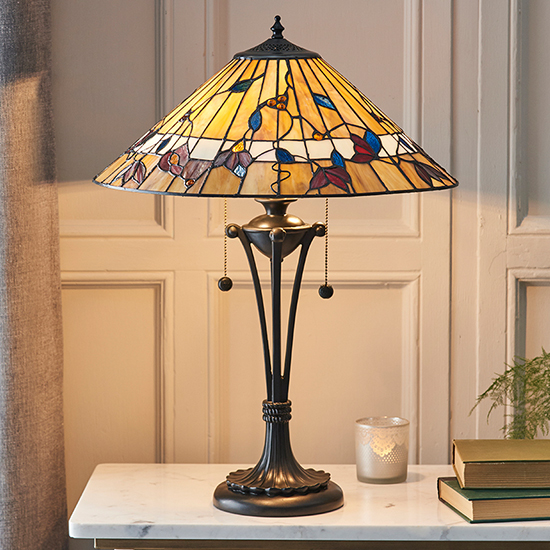 Photo of Bauchi medium tiffany glass table lamp in dark bronze