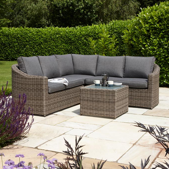 Photo of Baxton corner lounger set in natural rattan weave effect