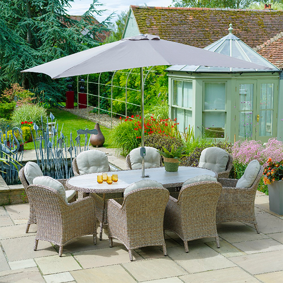 Photo of Becton oval 8 seater dining set with parasol in sand grey