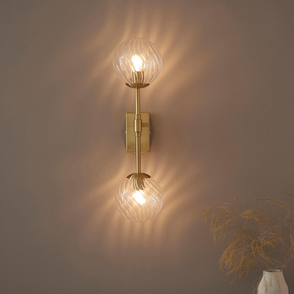Read more about Bemidji clear glass round wall light in brass