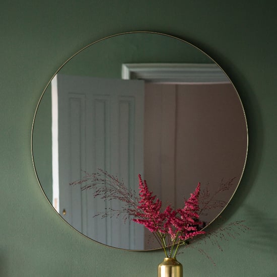 Photo of Benton round wall mirror with champagne metal frame