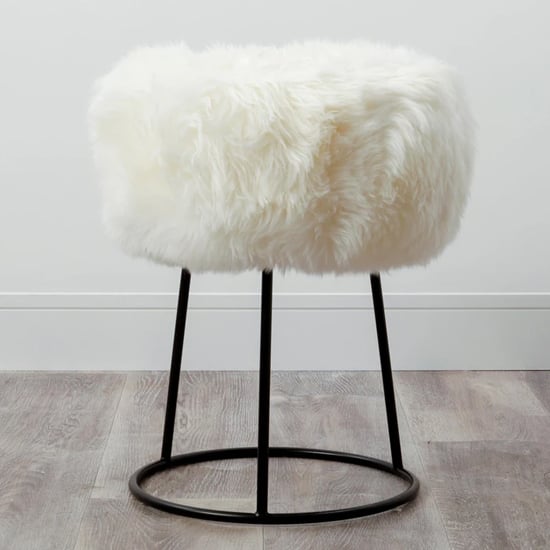 Product photograph of Bovril Sheepskin Stool With Black Metal Legs In Natural White from Furniture in Fashion