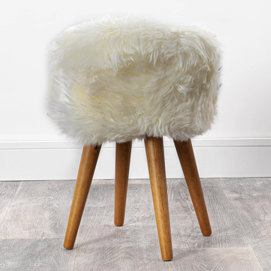 Photo of Bovril sheepskin stool with oak wooden legs in natural white