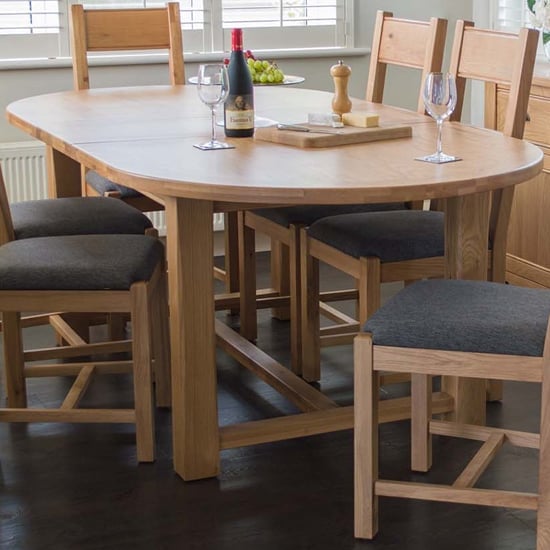 Photo of Brex oval wooden extending dining table in natural