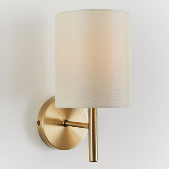 Photo of Brio cream fabric wall light in antique brass