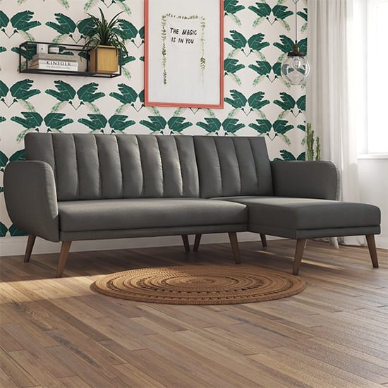 Read more about Brittan linen corner sofa bed with wooden legs in dark grey
