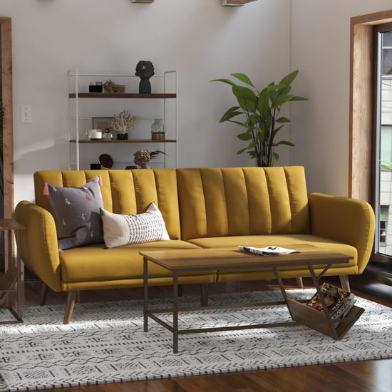 Photo of Brittan linen sofa bed with wooden legs in mustard