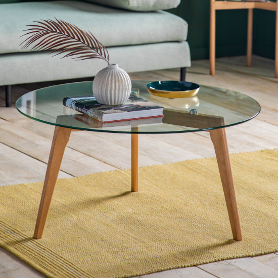 Photo of Brix round clear glass coffee table with natural oak base