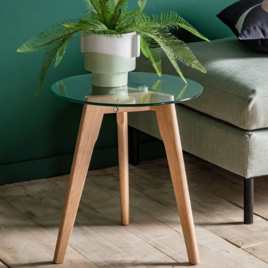 Photo of Brix round clear glass side table with natural oak base