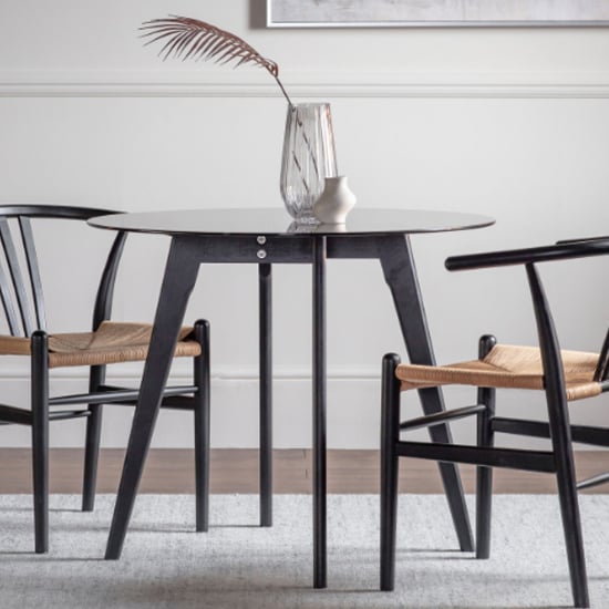 Photo of Brix round smoked glass dining table with black oak base