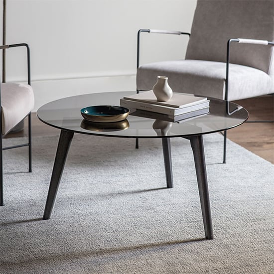 Product photograph of Brix Round Smoked Glass Coffee Table With Black Oak Base from Furniture in Fashion