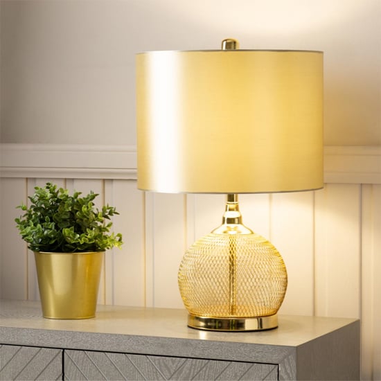 Photo of Burley champagne shade table lamp with gold wire mesh base
