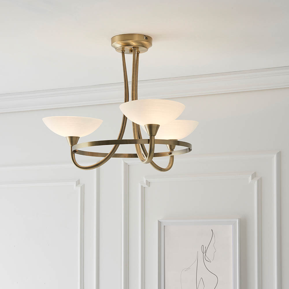 Read more about Cagney 3 light white glass shade flush light in antique brass