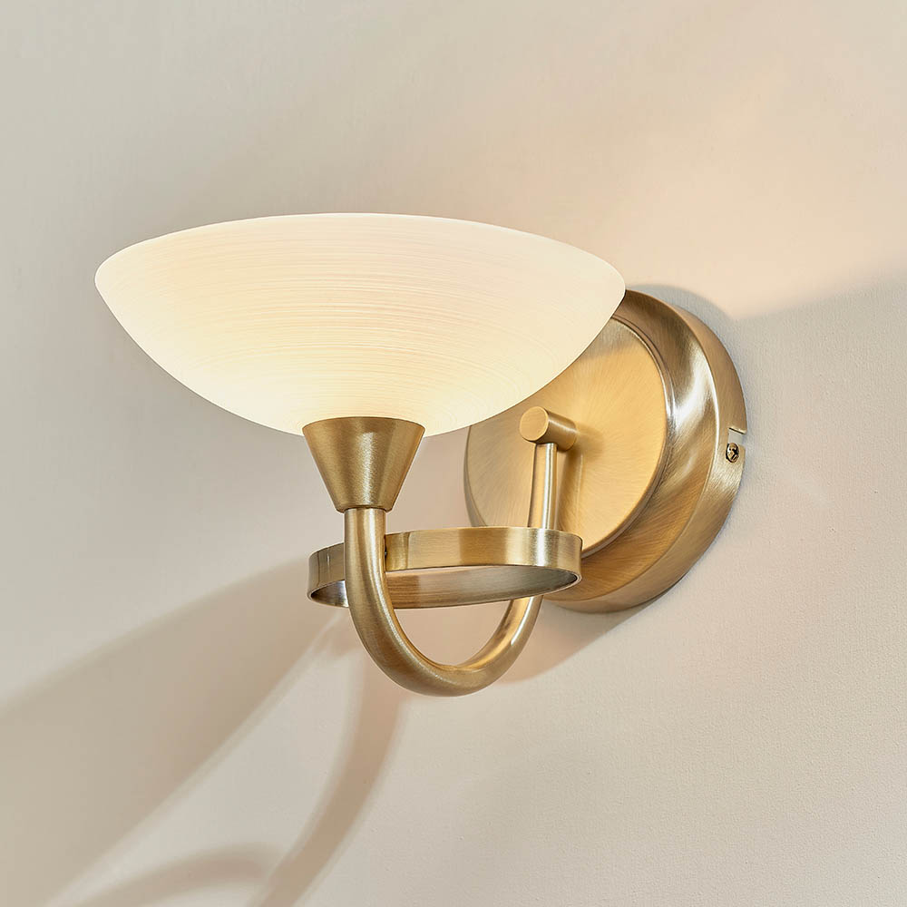 Read more about Cagney white glass shade wall light in antique brass