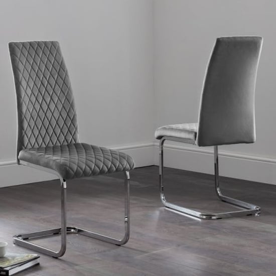 Photo of Cadewyn grey velvet cantilever dining chairs in pair