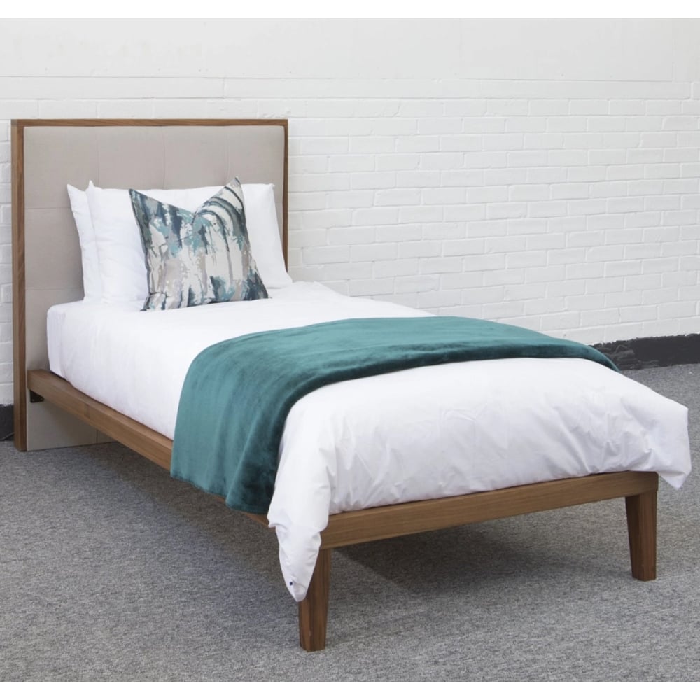 calhoun wooden single bed with fabric headboard in walnut