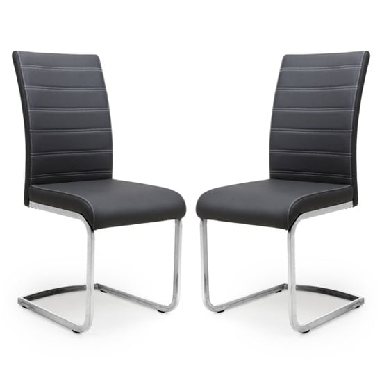 Photo of Conary black leather cantilever dining chair in a pair